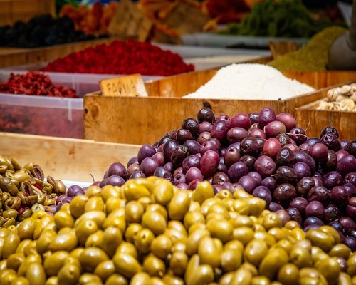 Mexican local market showing fresh produce like mangoes and nopales
